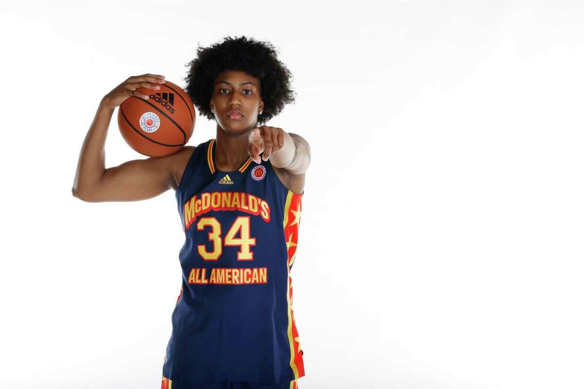 Ayanna Patterson in a navy McDonald's All American jersey number 34, pointing forward